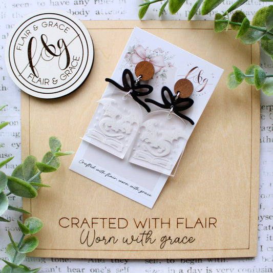 Bookish Earrings: Book stack with dragon and engraved on clear acrylic with bow