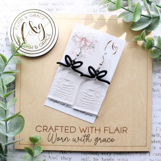 Bookish Earrings: Book stack engraved on clear acrylic with bow